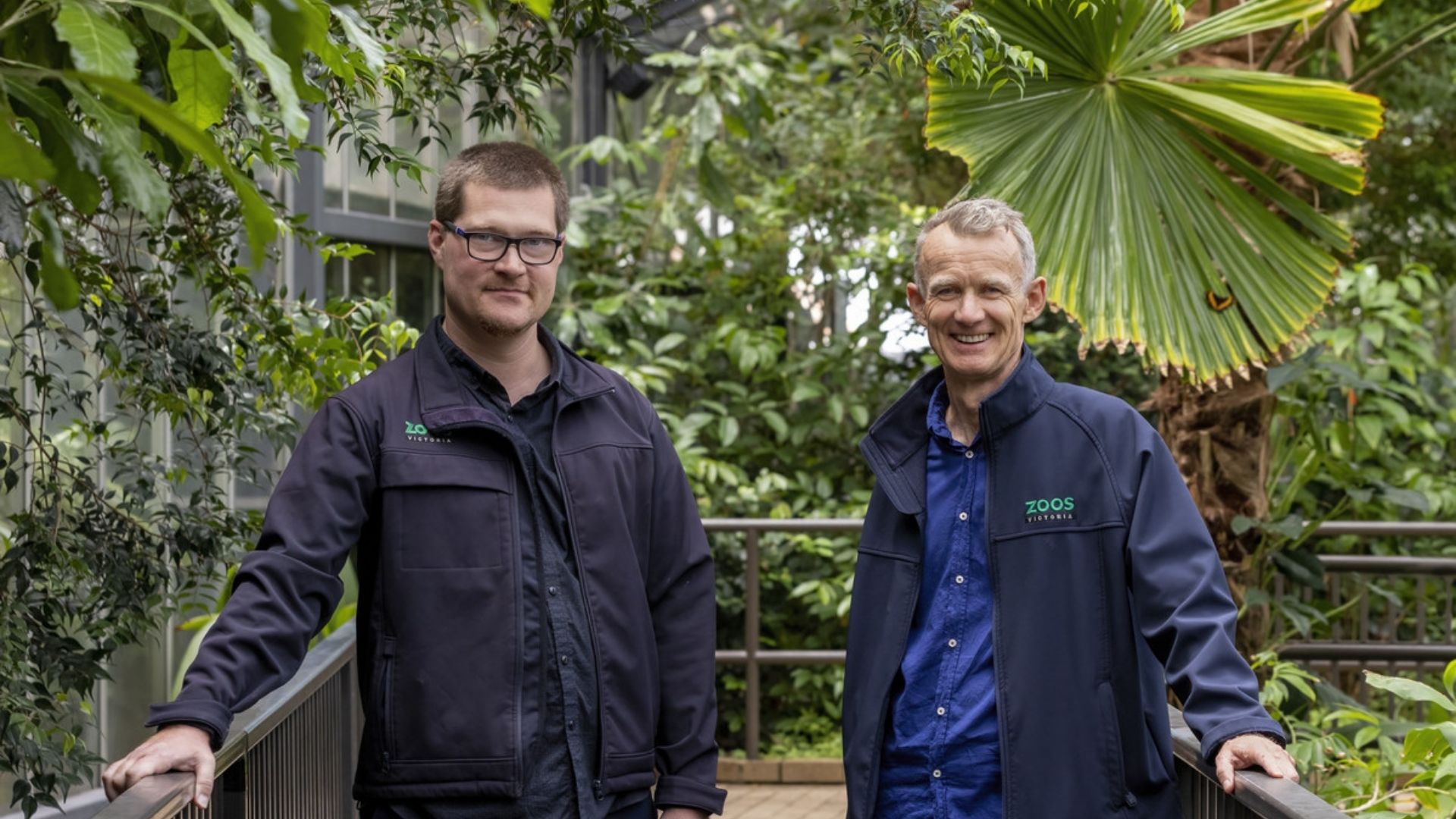 James is standing next to David Methven at the Zoo. Both are in their Zoos Victoria jackets.
