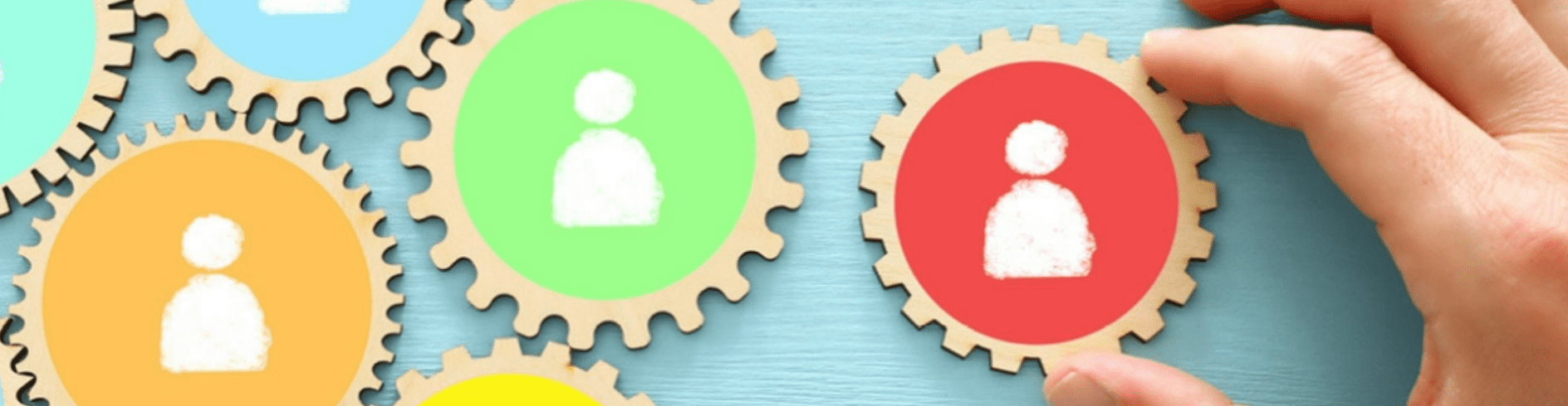 Images of people on different coloured cogs