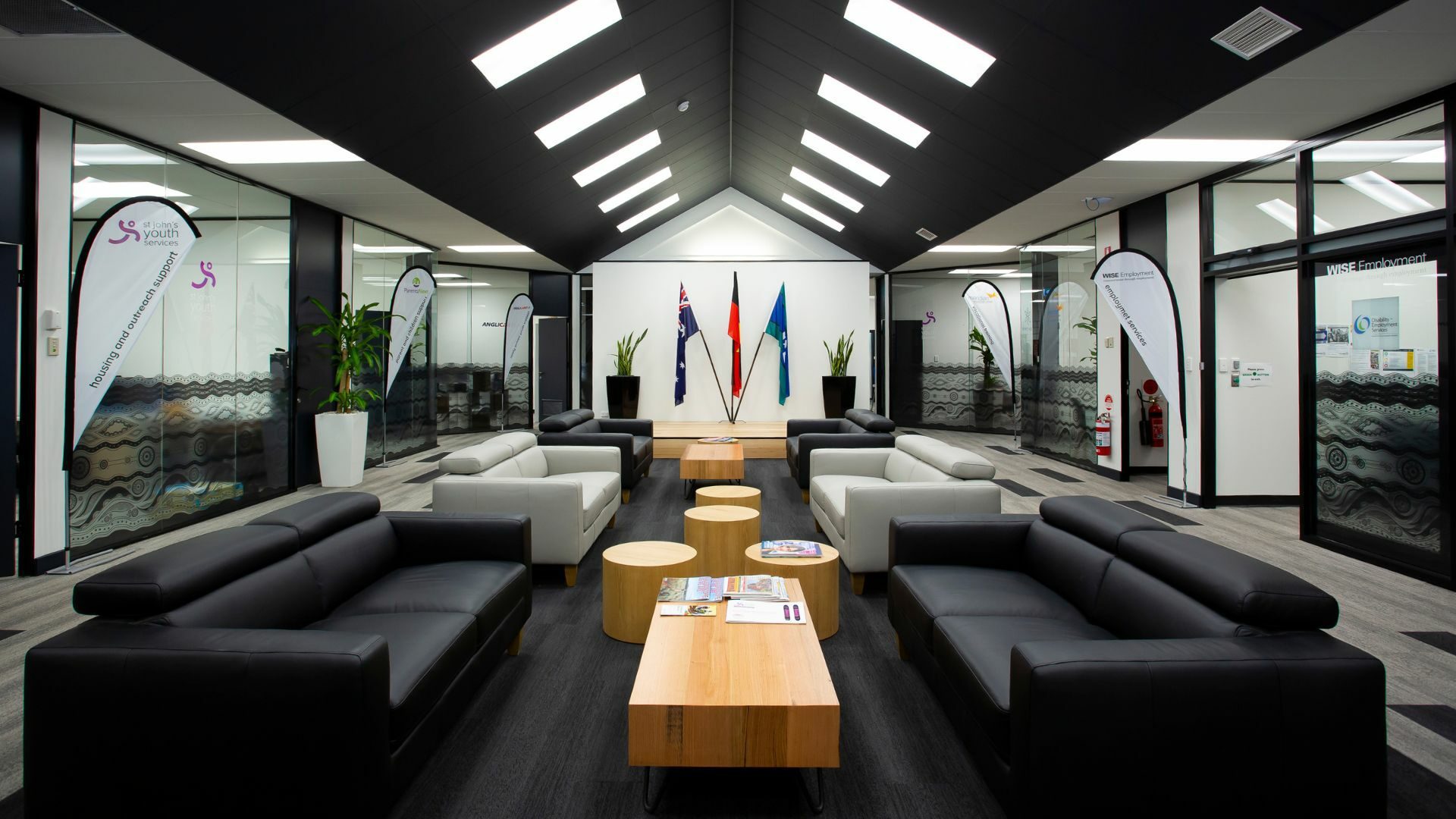 A lounge area with several sofas and coffee tables.