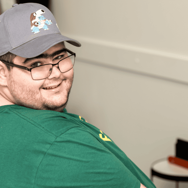 Noah smiling while playing a video game.